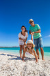 © travnikovstudio - Young beautiful family of three have fun on tropical vacation