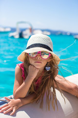 Poster - Cute little girl enjoying sailing on boat in the open sea