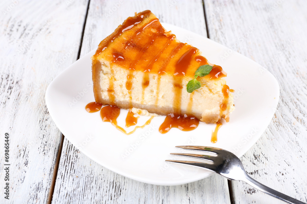 Cheese cake on plate on grey wooden background