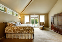 Luxury House Interior. Bedroom With High Vaulted Ceiling And Wal