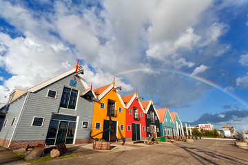 Fototapete - rainbow over buildings in Zoutkamp