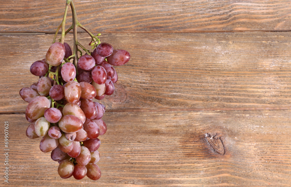 Bunch of grape on wooden background