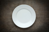 Fototapeta  - Empty  white plate on wooden background