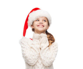 Wall Mural - dreaming girl in santa helper hat