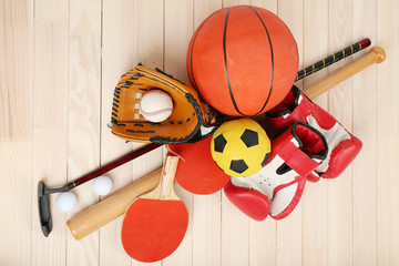 Wall Mural - Sports equipment on wooden background