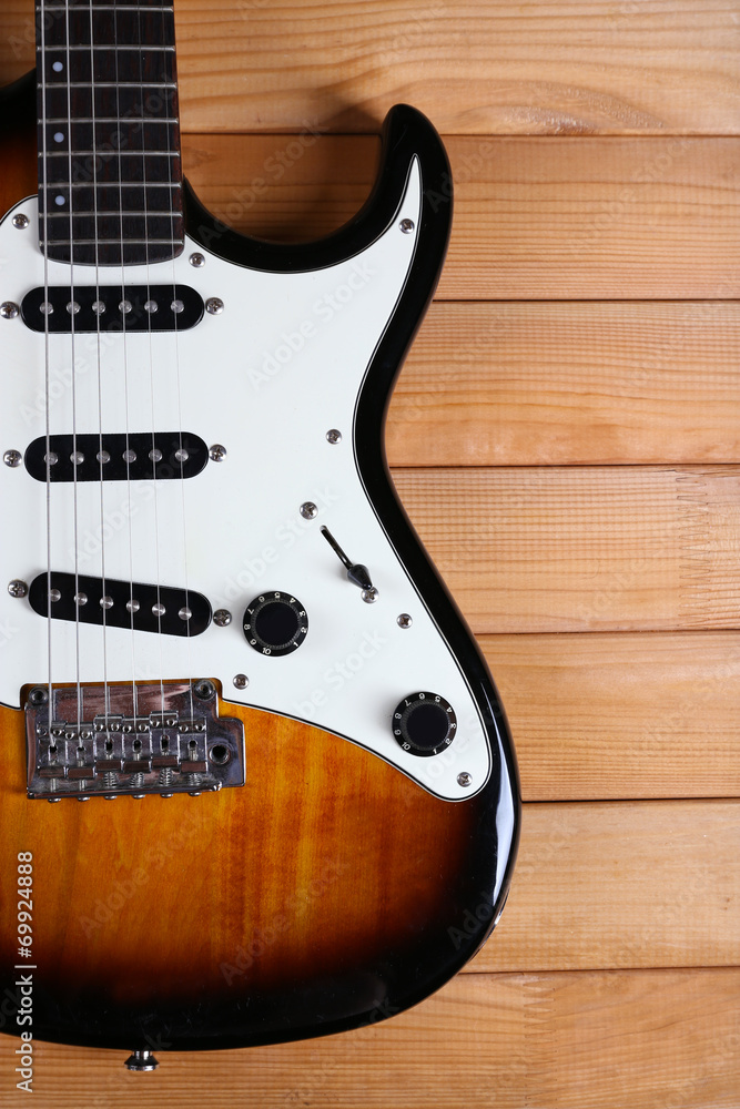 Guitar on wooden background