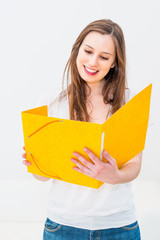 Young smiling woman reading book