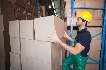 Warehouse worker loading up a pallet