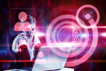 Poster - Composite image of redhead businesswoman using her laptop