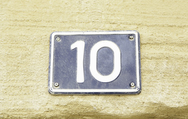 Number ten on the wall of a house