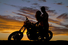 Silhouette Couple Kiss On Motorcycle
