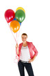 © Wisiel - woman with balloons over white background smiling
