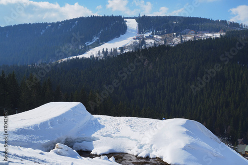 Fotografie, Obraz Snowpark in the middle of a snowy mountain.