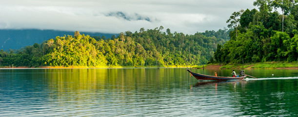 Wall Mural - landscape of water with boat in ratchaprapa dam, thailand