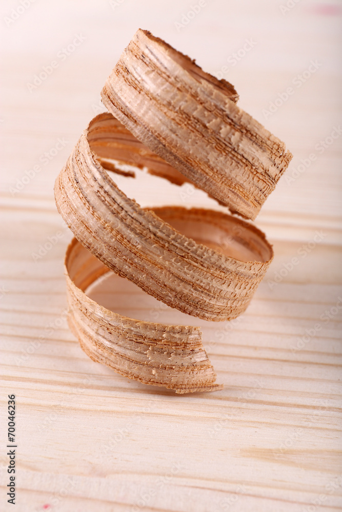 Wooden shavings on wooden background
