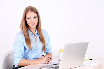 Business woman with documents at her workplace