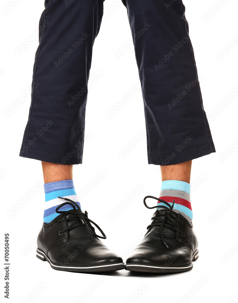 Man leg in suit and colorful socks, isolated on white