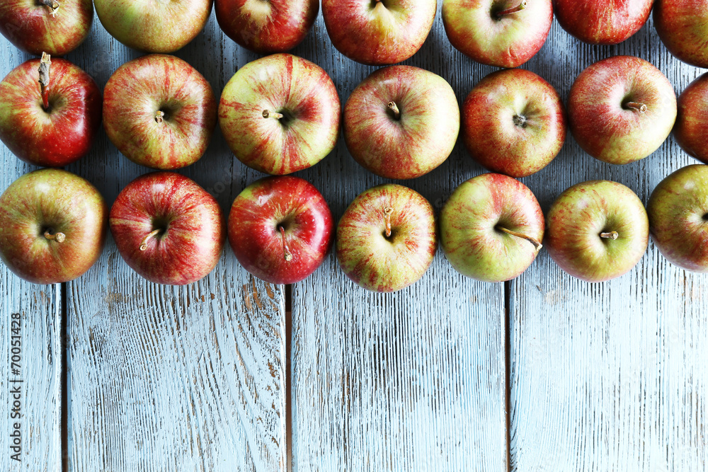 Juicy apples on wooden table, close-up