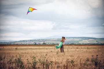 happy young couple flying a kite