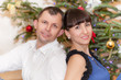 © liandstudio - Christmas Couple.Happy Smiling Family at home celebrating