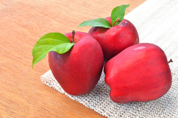 group of red apples and green leaf