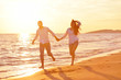 © .shock - young couple  on beach have fun