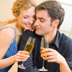 Canvas Print - Cheerful couple with champagne