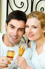 Canvas Print - Cheerful couple with champagne