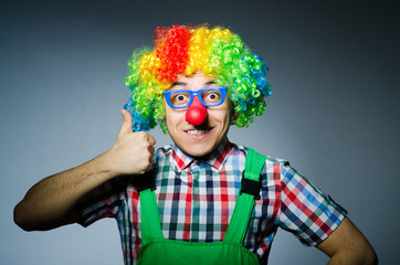 Funny clown against the dark background