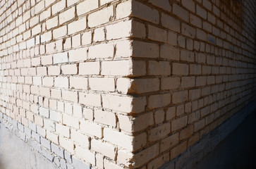  Wide angle view of the corner of a building made of white bricks