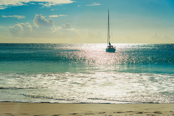 Wall Mural - Yacht at beach at sunset. Anse Georgette, Praslin , Seychelles