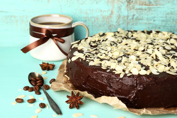 Poster - Tasty chocolate cake with almond, on old wooden table