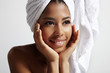 beauty young black woman with a towel on her head and wet skin