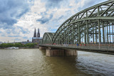 Fototapeta Mosty linowy / wiszący - Cologne Cathedral and skyline, Germany