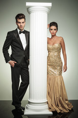 Wall Mural - luxury couple posing in studio near column