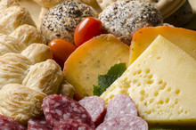 Assorted Cheeses With Bread, Tomatoes And Sliced Salami