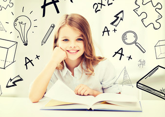 Wall Mural - little student girl studying at school