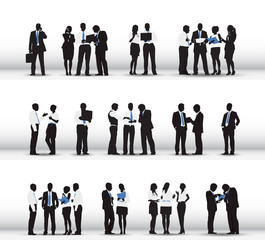 Wall Mural - Silhouettes of Business People Working in a Row