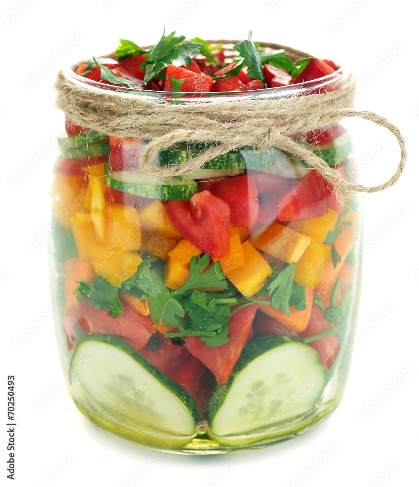 Vegetable salad in glass jar, isolated on white