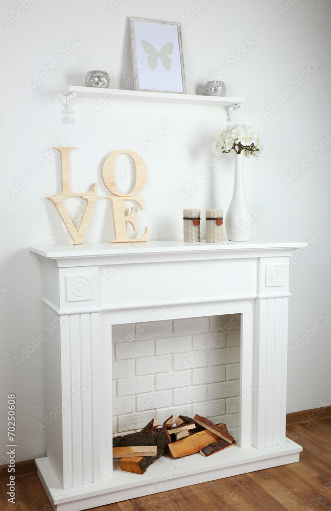 Fireplace with beautiful decorations in comfortable living room