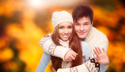 Poster - happy young couple over autumn background