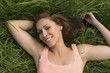 © paulmz - Happy woman relaxing in meadow