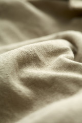 Wall Mural - Close up of beige material on clothing.