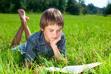 Child Reading Book Outdoor