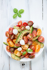 Wall Mural - Salad with grilled avocado, tomatoes, mozzarella balls and basil