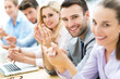 © pikselstock - Business team clapping in applause