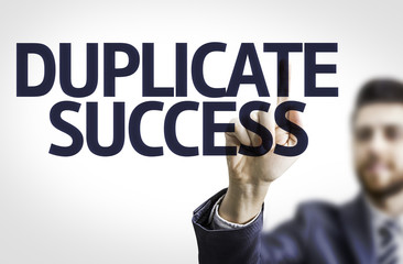 business man pointing the text: duplicate success