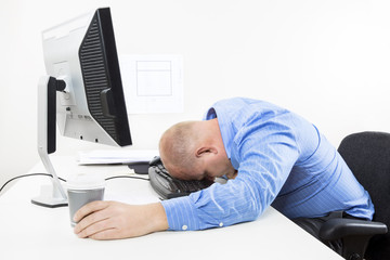 Wall Mural - Overworked businessman at the office