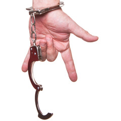 male hand in police handcuffs showing gesture isolated