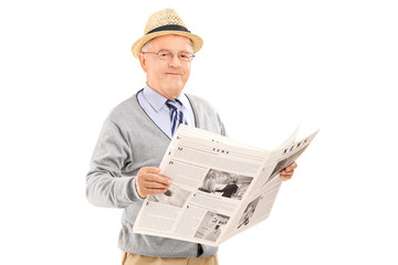 Senior gentleman holding a newspaper isolated on white backgroun